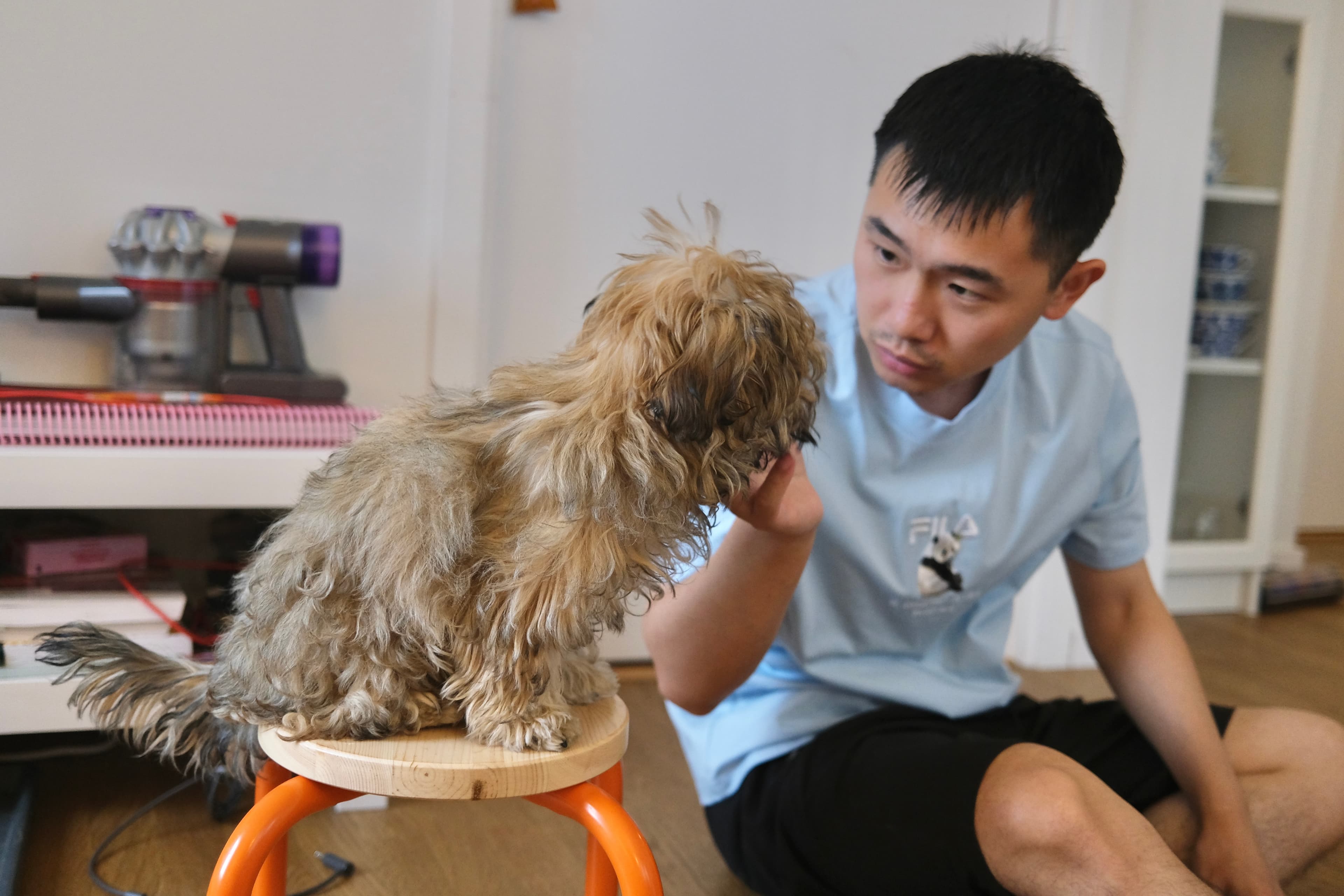Evan and a puppy making eye contact during a calm interaction